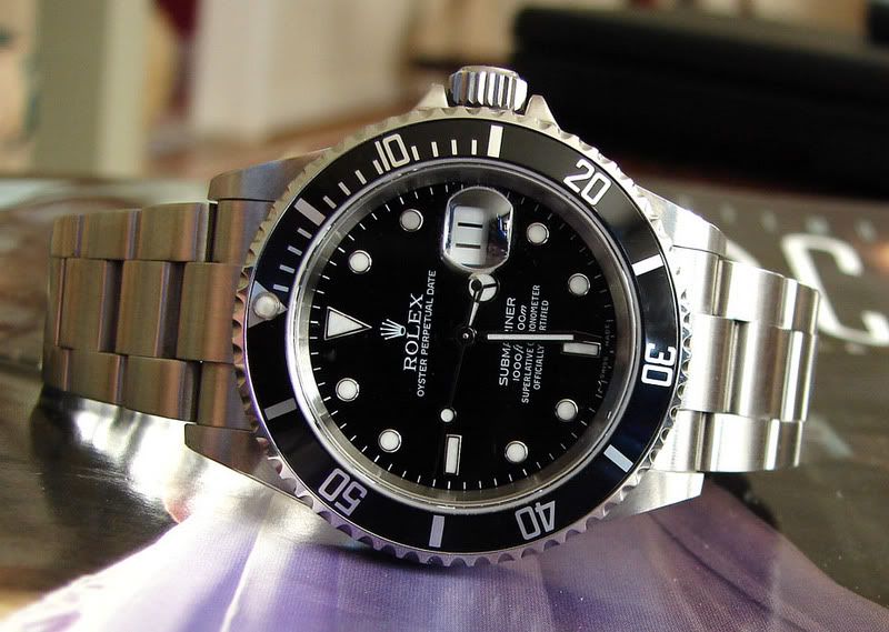 Rolex Submariner Date in all stainless steel with solid end link flip lock 